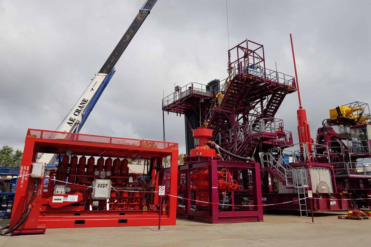 Nigerian oilfield technicians inspecting wellhead equipment Niger Delta